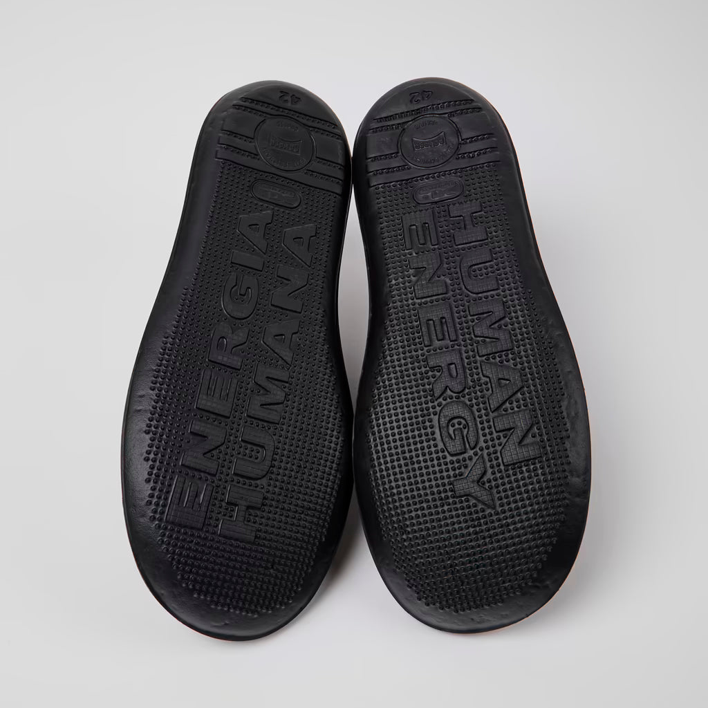 Black insole with brand name on a white background