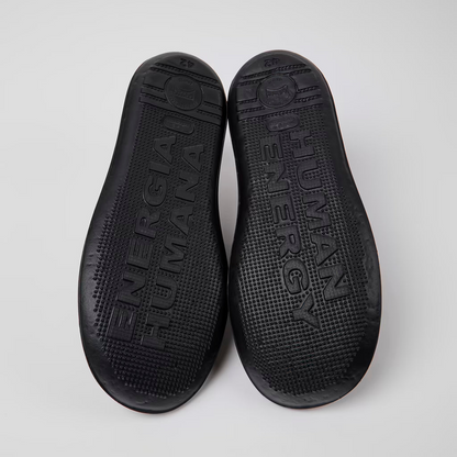 Black insole with brand name on a white background