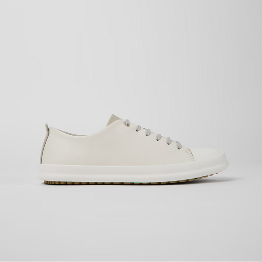 White sneaker on a light gray background