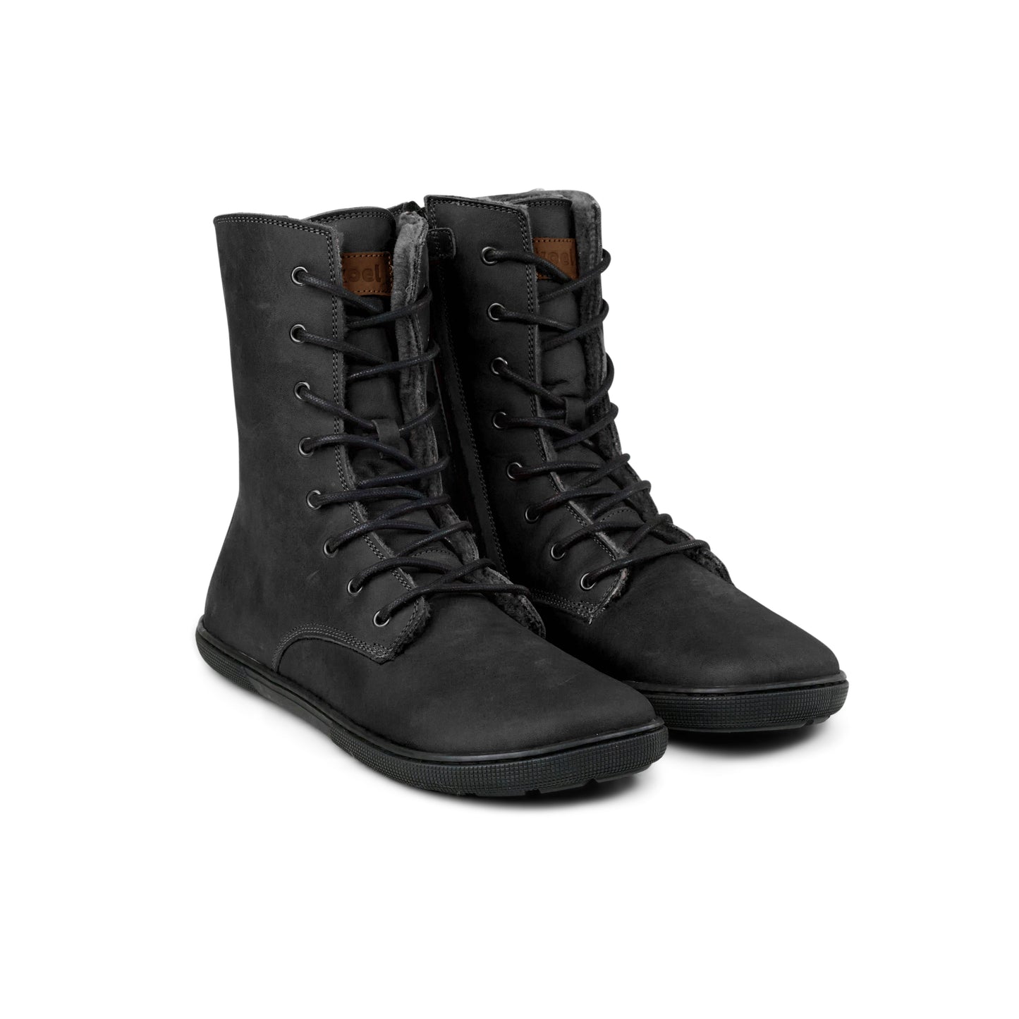 Pair of black Koel Faro Lambswool barefoot boots with wool lining