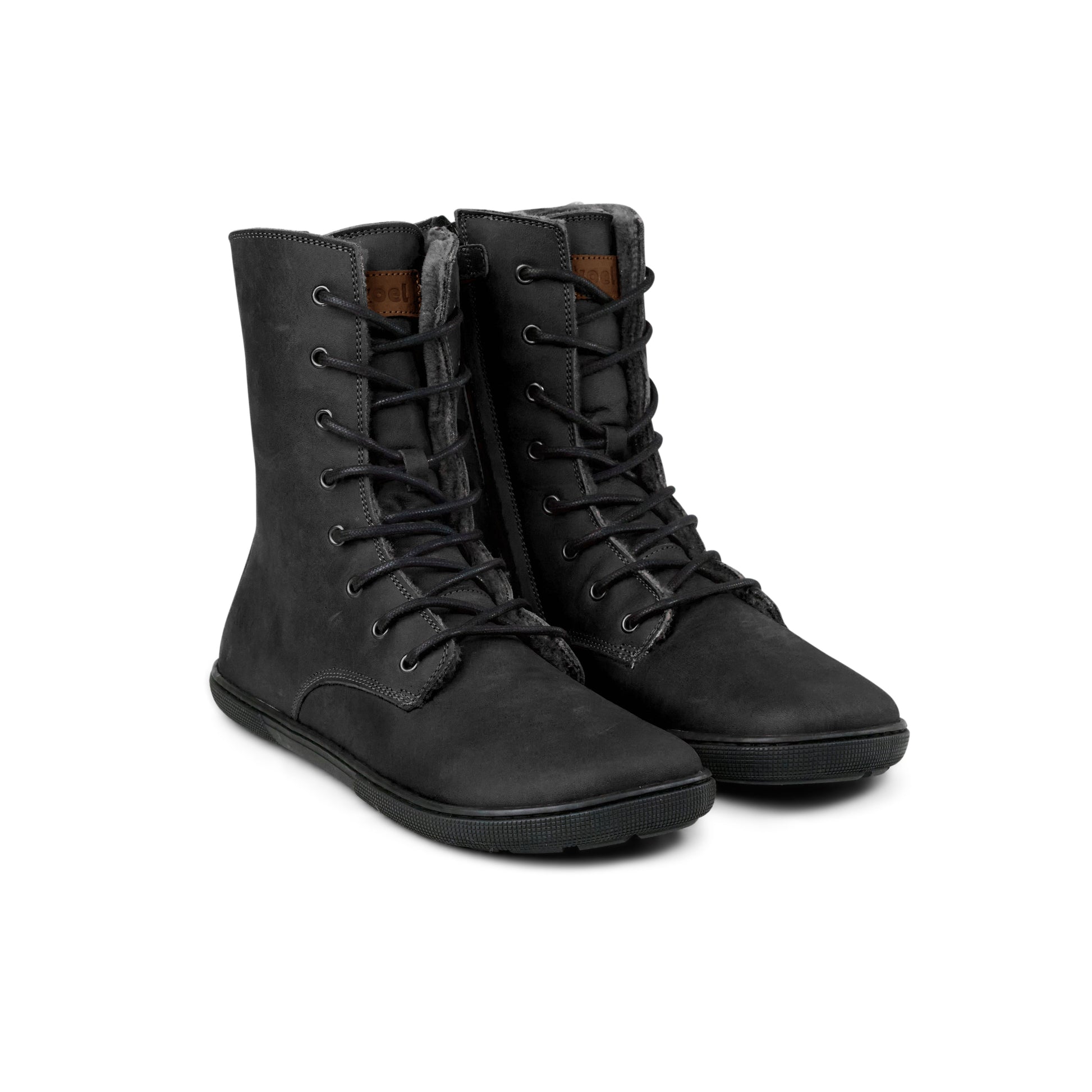 Pair of black Koel Faro Lambswool barefoot boots with wool lining