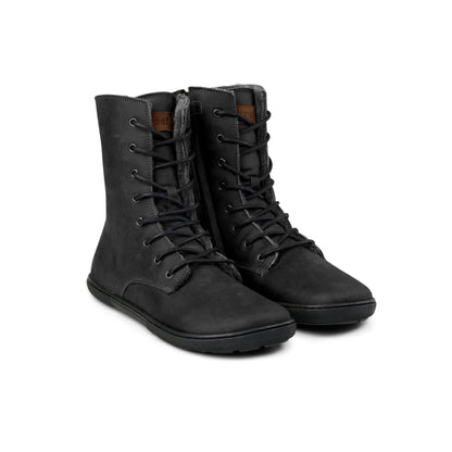 Pair of black Koel Faro Lambswool barefoot boots with wool lining